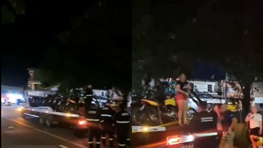 Vídeo: mulher sobe em caminhão para impedir apreensão de moto