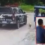 Três guardas municipais em Tefé, Amazonas, são flagrados em possível situação de abuso de autoridade. Um deles segura uma mulher, enquanto outro conversa com ela.