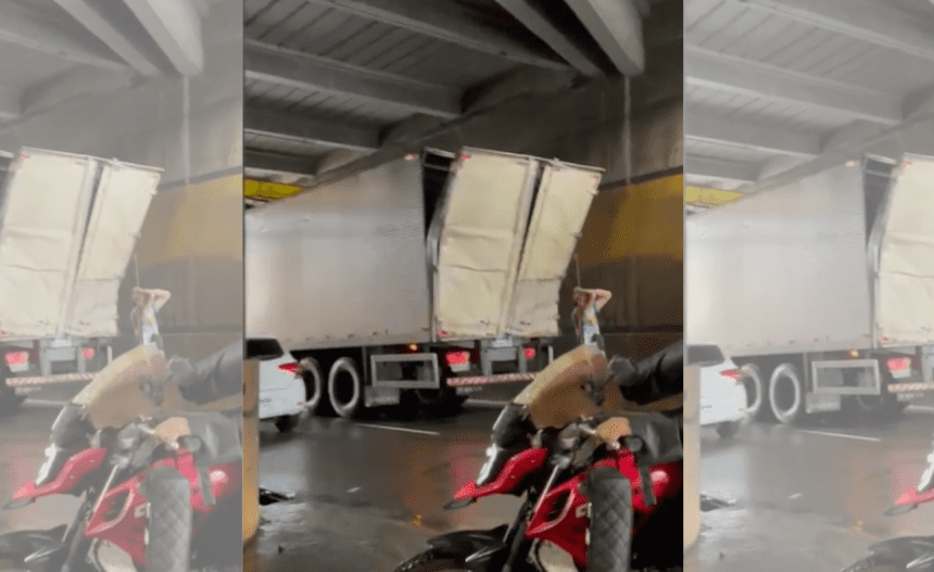 Imagem colorida mostra caminhão entalado em viaduto no bairro São Jorge no dia 12 de junho