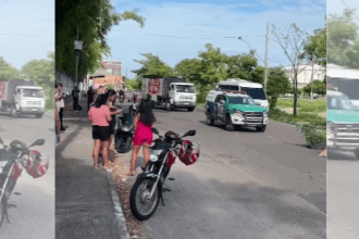 Imagem colorida mostra carro da polícia militar próximo a corpo estirado no chão na Manaus 2000