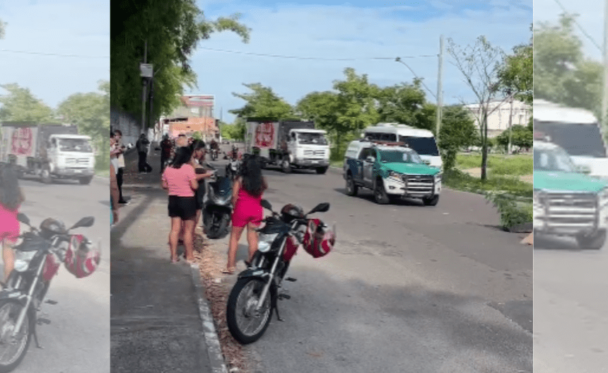 Imagem colorida mostra carro da polícia militar próximo a corpo estirado no chão na Manaus 2000