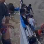 Imagem colorida mostra homem que pulou de barco sendo resgatado