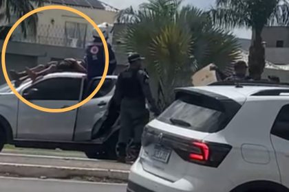 Acidente de trânsito na Avenida Ephigênio Salles, Manaus, com pessoas sobre um carro.