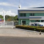 Fachada da Colortech em Manaus, com portão de entrada e logotipo.