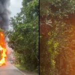 Incêndio em caminhão-tanque na BR-174 após tombamento, com chamas e fumaça densa.