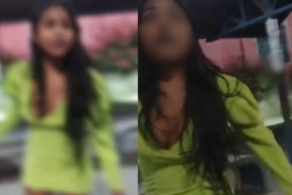Mulher em vestido verde em Manaus, relacionada a acusações de não pagamento de corridas de aplicativo.