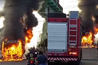 Ônibus em chamas no Distrito Industrial após incêndio.