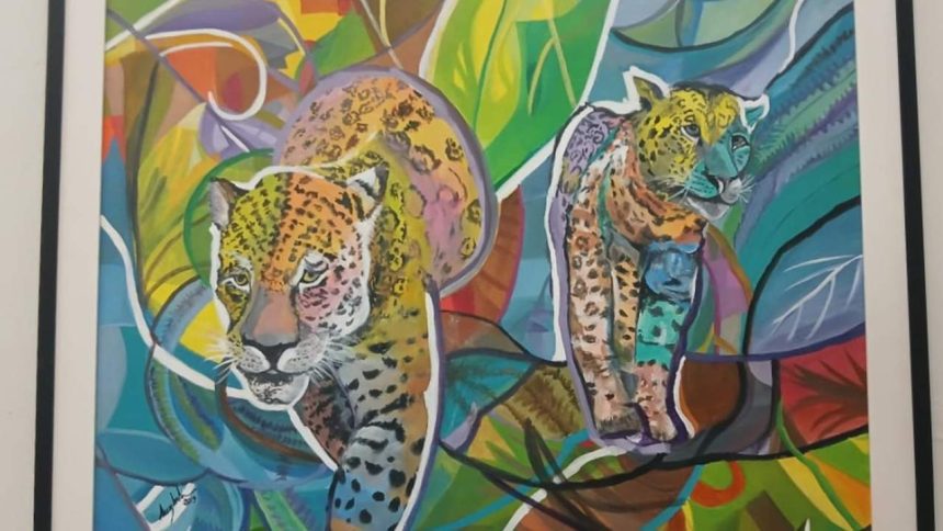 Pintura abstrata de dois jaguares em meio à folhagem colorida, representando a fauna amazônica.