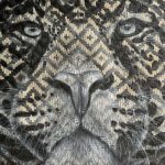 Retrato de jaguar em arte sensorial com padrões geométricos