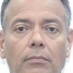 Rosto de um homem de meia-idade, possivelmente venezuelano, com fundo branco.