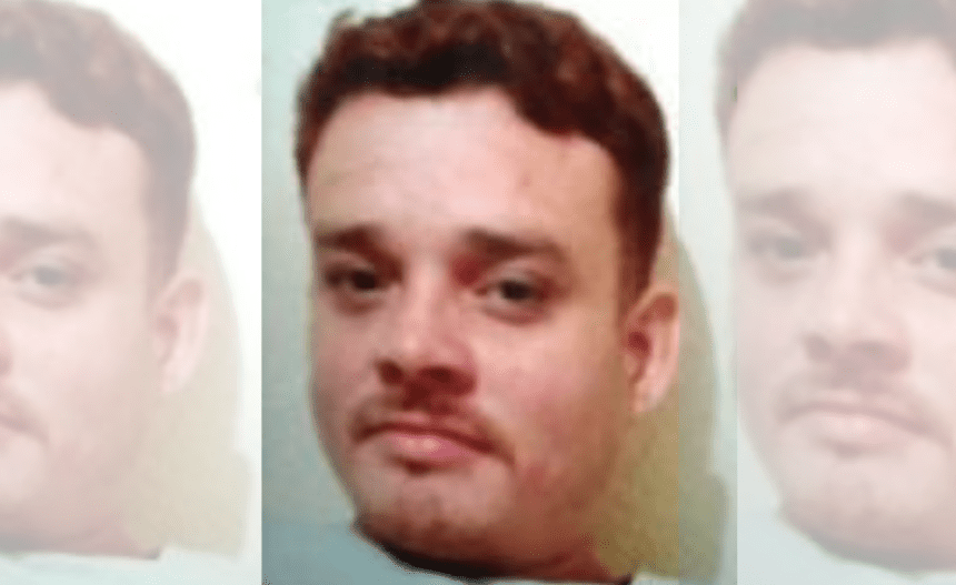 Imagem colorida mostra foto de suspeito de feminicídio