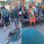 Acidente de trânsito com motociclista e criança feridos em rua.