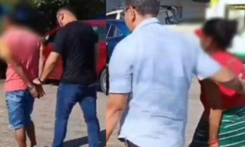 Mulher e homem sendo presos acusados de exploração sexual infantil.