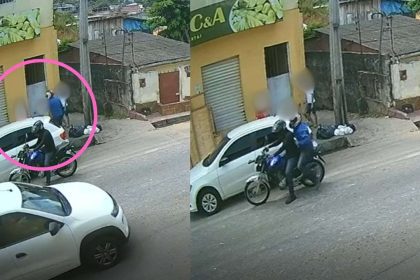 Assalto a mão armada registrado por câmera de segurança: criminosos em fuga de moto após roubo.