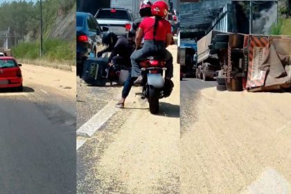 Carreta tomba na Avenida das Flores, espalhando soja na pista.