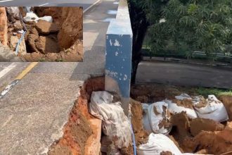 Deslizamento de terra próximo à Ponte dos Bilhares em Manaus, mostrando danos e sacos de areia.