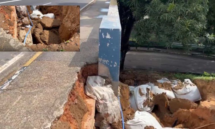 Deslizamento de terra próximo à Ponte dos Bilhares em Manaus, mostrando danos e sacos de areia.