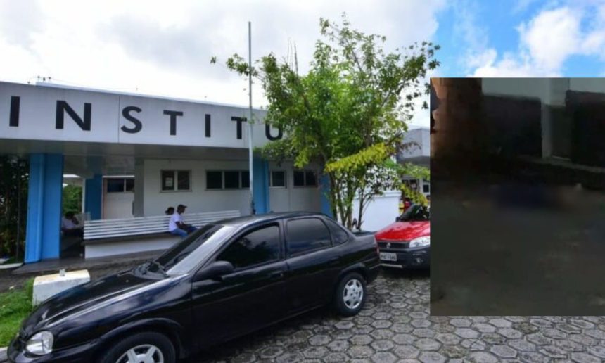 Fachada do instituto com carros estacionados na frente.