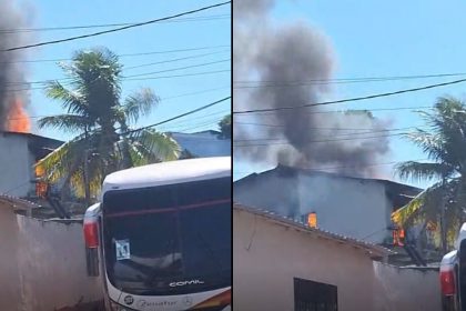 Incêndio em casa de dois andares com fumaça e chamas visíveis