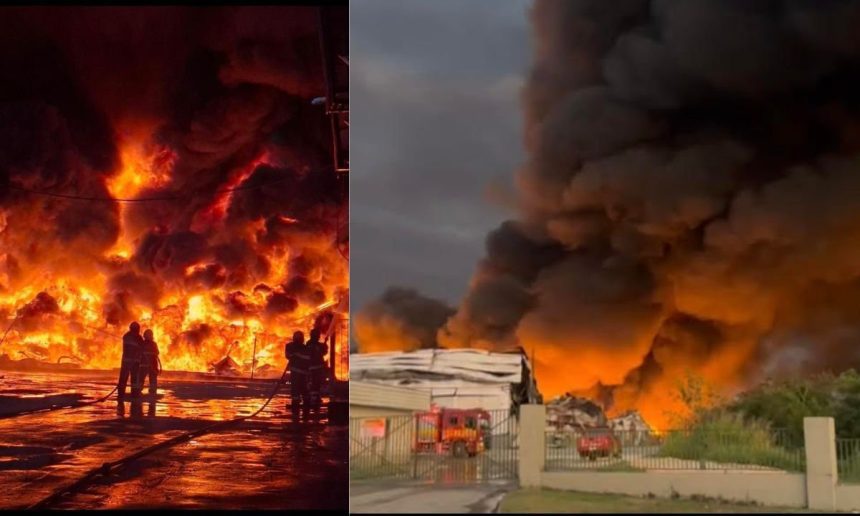 Incêndio em fábrica no Distrito Industrial II, Manaus, com bombeiros combatendo as chamas e fumaça densa.