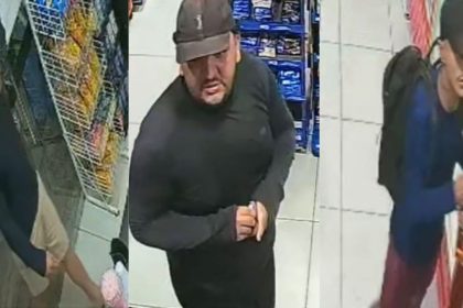 Três suspeitos de assalto em loja de conveniência, com roupas escuras e bonés.