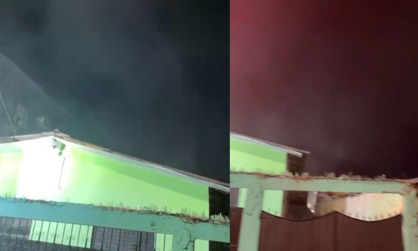 Incêndio em residência no bairro Japiim, Manaus. Fumaça escura e casa em chamas.