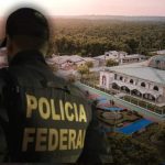 Policial Federal observa cidade em investigação no Amazonas.
