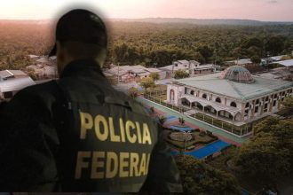 Policial Federal observa cidade em investigação no Amazonas.