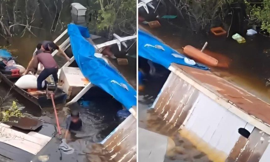 Embarcação naufragada durante temporal no Lago de Coari, com pessoas tentando resgatar pertences.