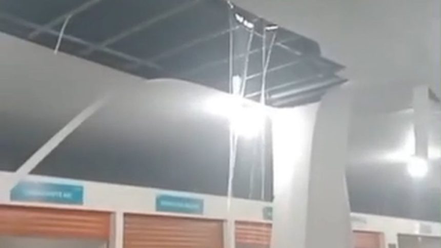 Feira alaga após obra de R$ 1 milhão, mostrando 'cachoeira' no teto durante chuva.