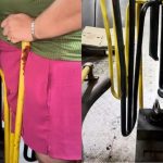 Mulher presa em catraca de ônibus, sendo resgatada.