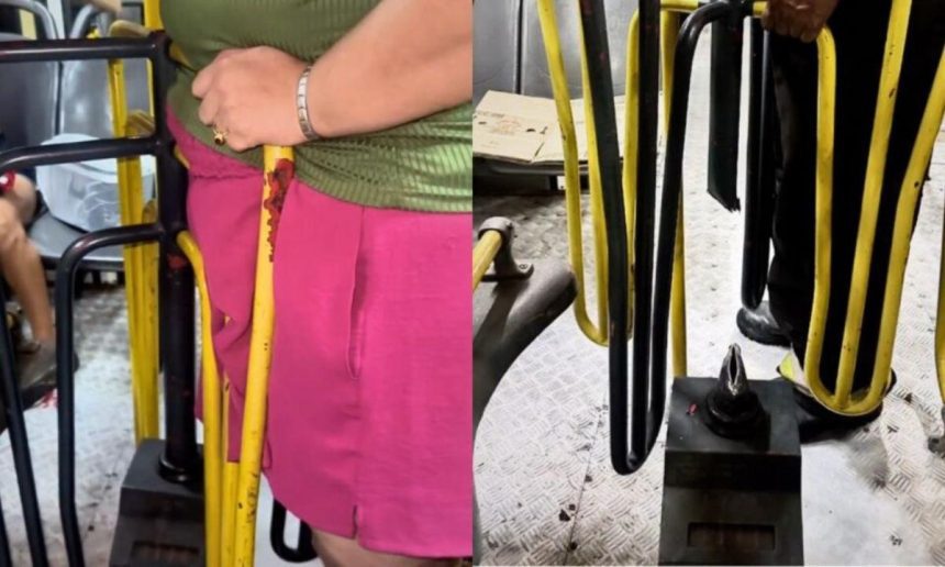 Mulher presa em catraca de ônibus, sendo resgatada.