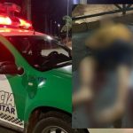 Carro da Polícia Militar e cena de crime com corpo coberto.