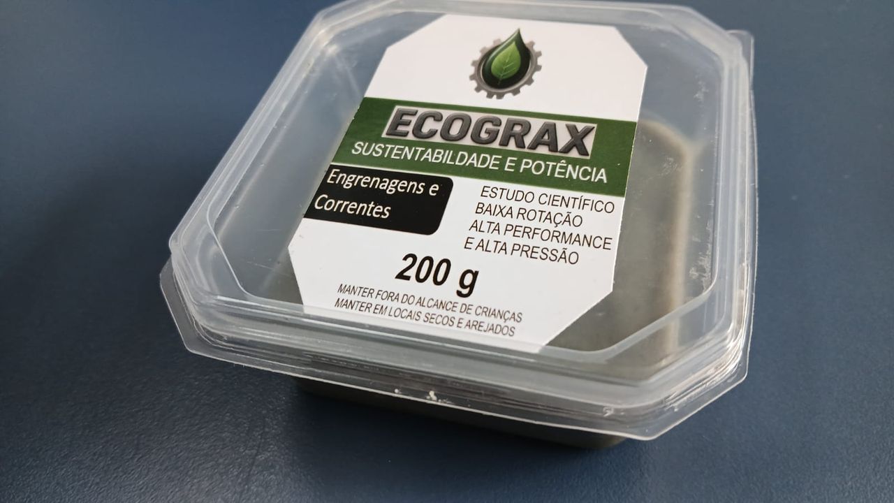Embalagem de produto ECOGRAX para engrenagens e correntes, com rótulo verde e branco.