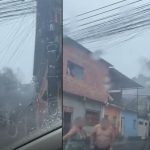 Incêndio em casa na Rua Garça Vermelha, Manaus, com fumaça densa e pessoas correndo.