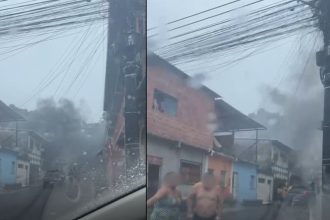 Incêndio em casa na Rua Garça Vermelha, Manaus, com fumaça densa e pessoas correndo.