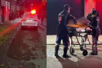 Socorristas atendem vítima em Manaus após agressão, com ambulância no local