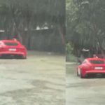 Chuva forte deixa carro de luxo parado em trecho alagado no bairro Tarumã