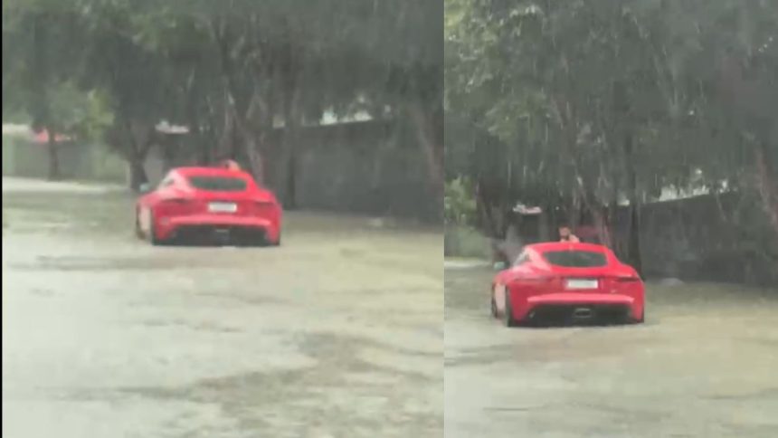 Chuva forte deixa carro de luxo parado em trecho alagado no bairro Tarumã