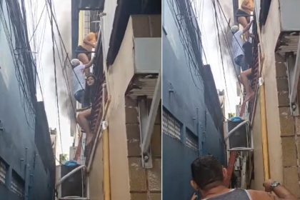Moradores utilizam escada para deixar casa durante incêndio em vila na zona sul de Manaus