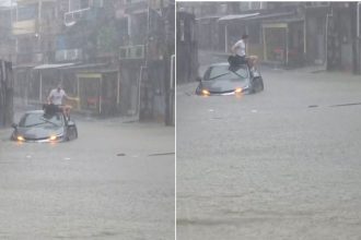 Motorista fica ilhado e sobe em veículo durante alagamento na zona sul de Manaus