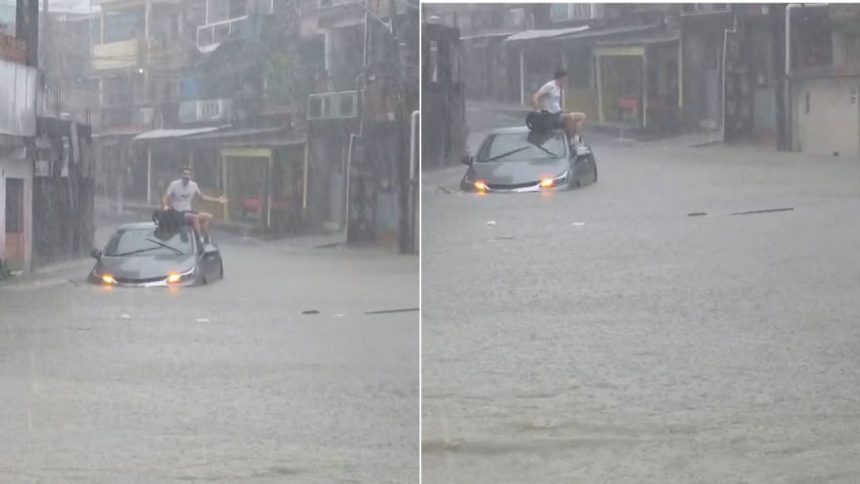Motorista fica ilhado e sobe em veículo durante alagamento na zona sul de Manaus