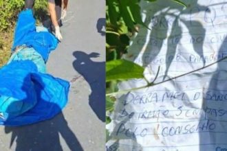 Corpo coberto por lona azul ao lado de uma folha com escrita manuscrita