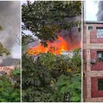 Incêndio em residências, com fumaça densa e chamas visíveis.